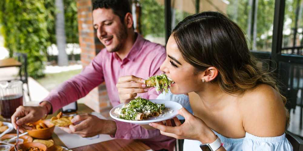 Resident couple enjoying meal at a restaurant near Central West End Apartments in Saint Louis, Missouri