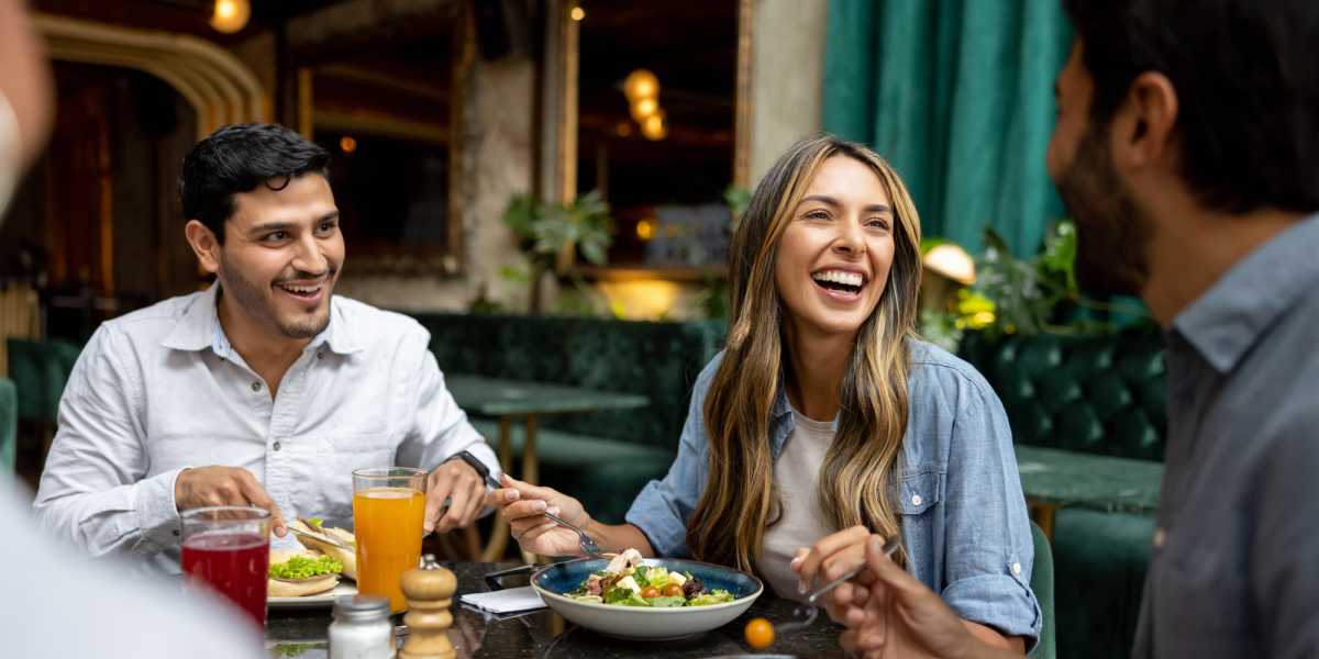 residents enjoying food in restaurant near The Meridian in Washington, District of Columbia