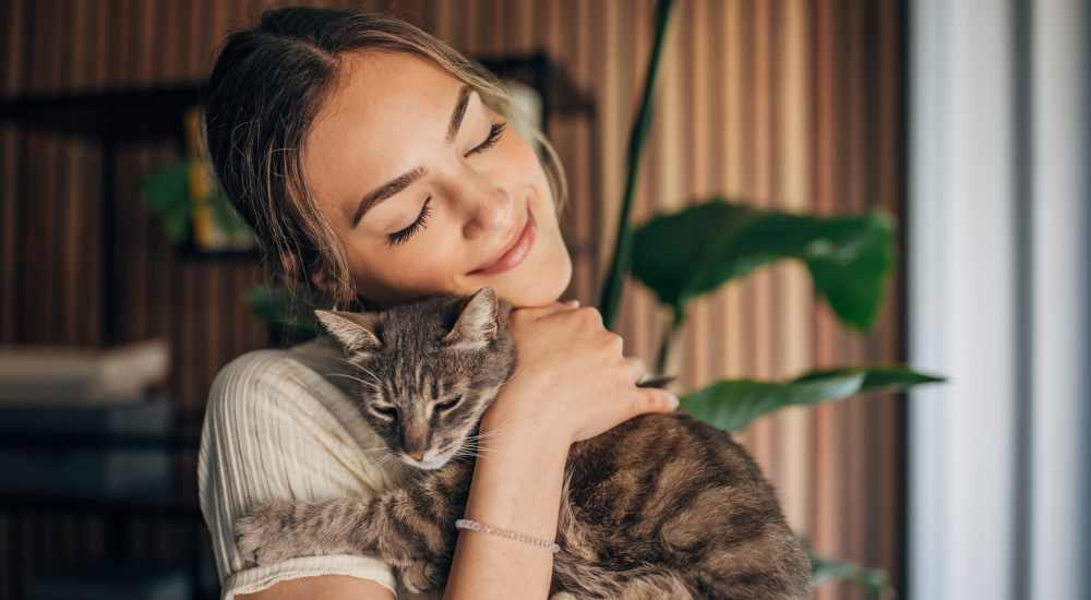 Resident cuddling her pet at Tustin Gardens in Tustin, California