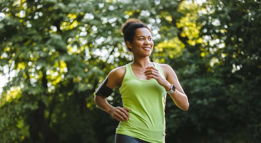 Residents jogging in a park near The Apartments At Kelton Station in Williamsburg, Virginia