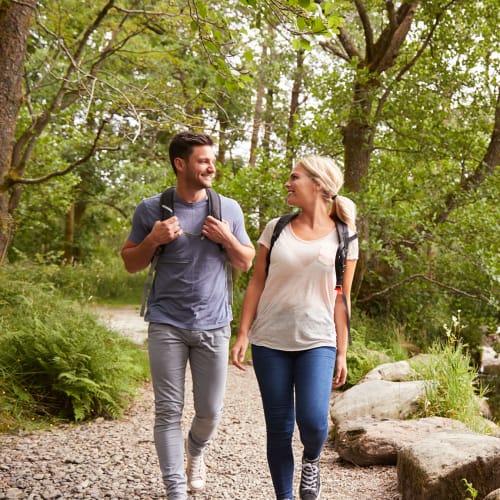 A couple takes a nature hike near SoLa Apartments in Los Angeles, California