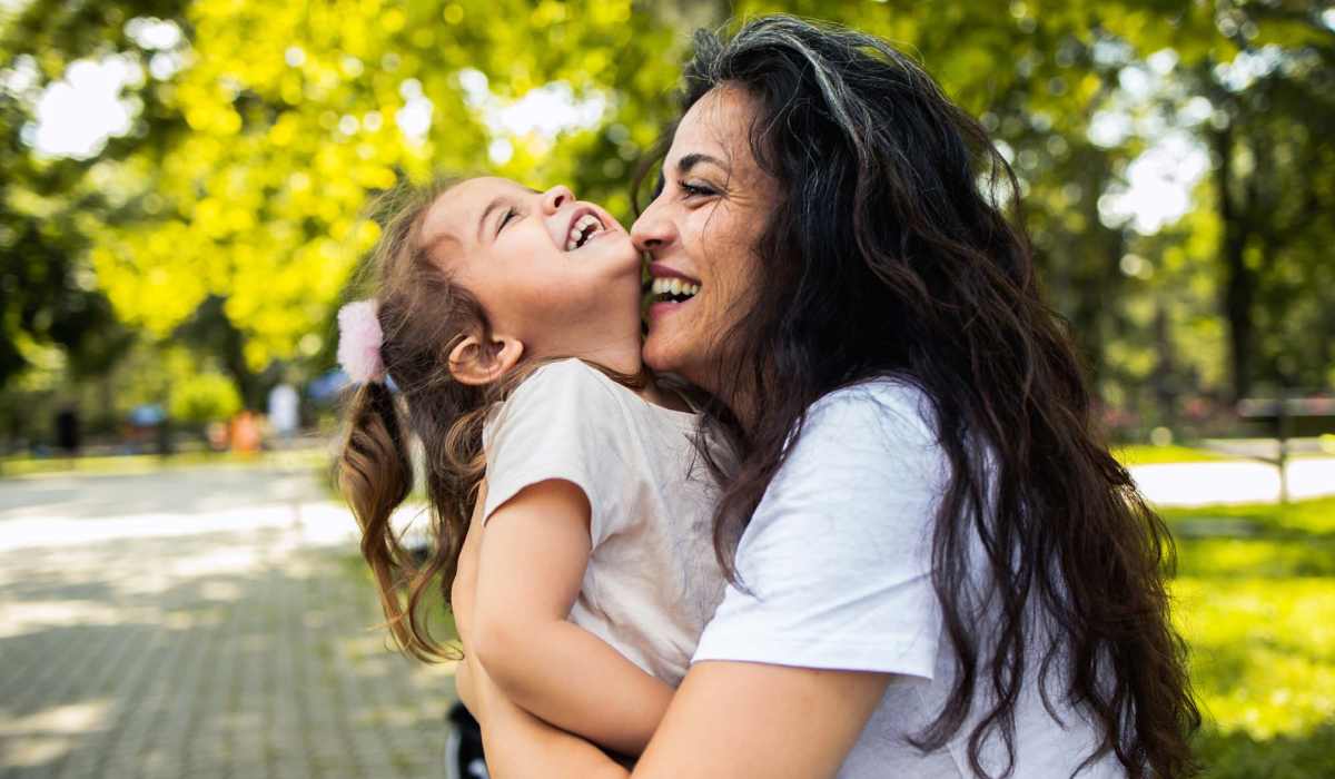 Resident withe her daughter at a park near Hamlet Court Apartments in Rochester, New York
