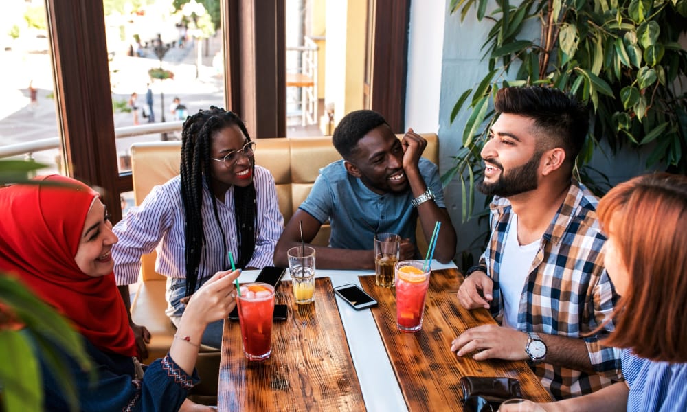Residents out for a fantastic meal at their favorite downtown restaurant near The Avant at Steele Creek in Charlotte, North Carolina