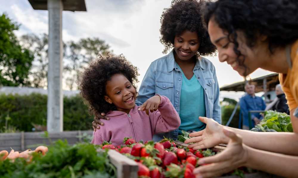 Resident shopping at a produce market near Briarwick Apartments in Kokomo, Indiana