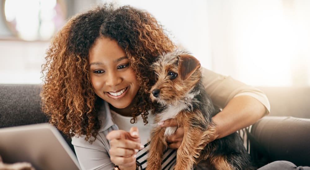 Resident with her dog at The Presidio in Pensacola, Florida