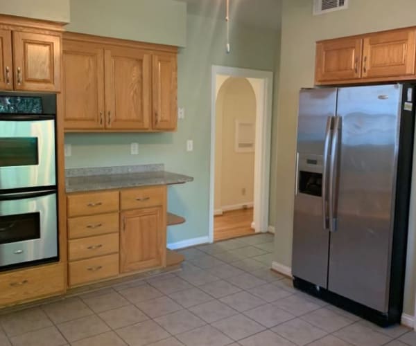A kitchen with appliances in a home at Breezy Point in Norfolk, Virginia