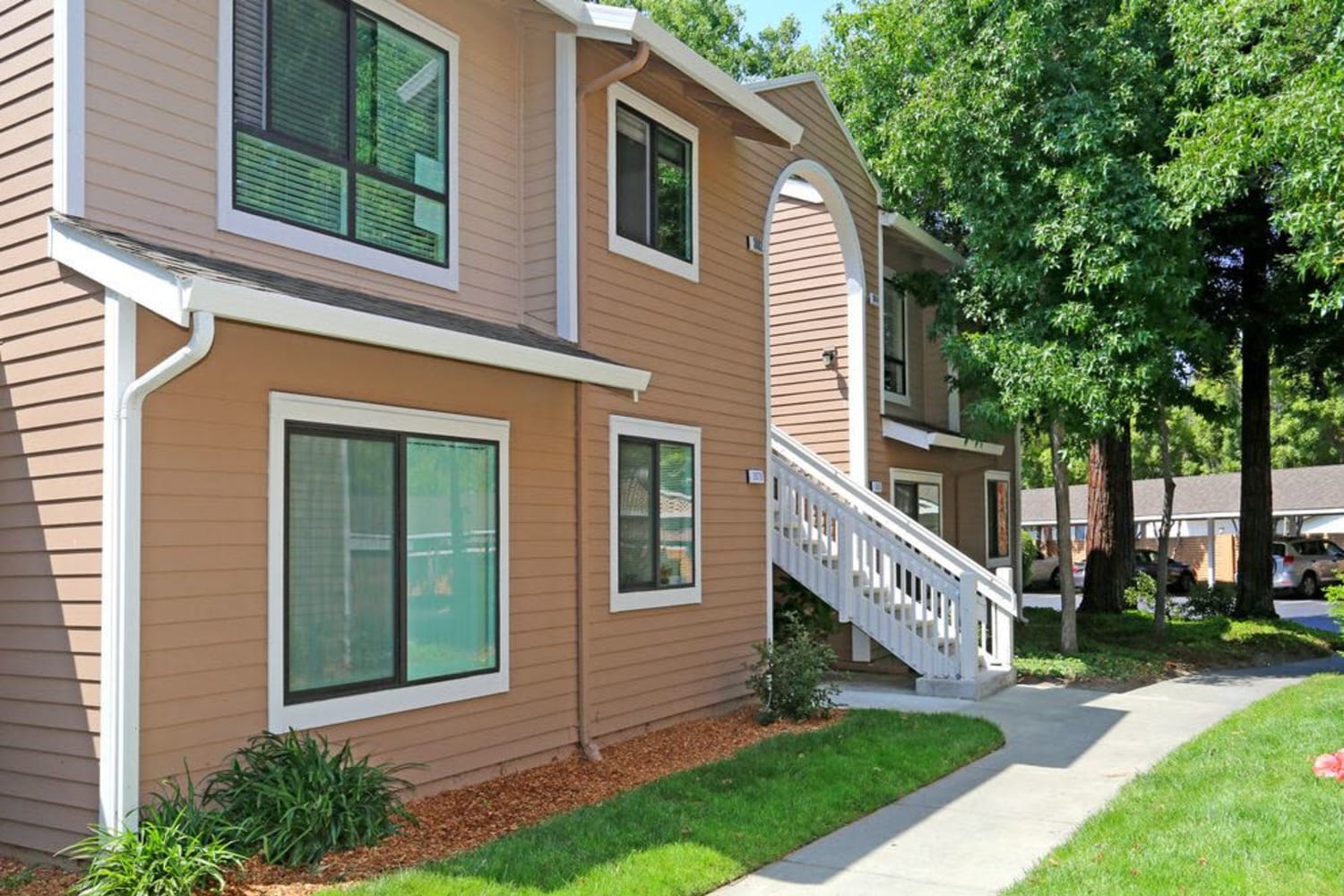 Exterior view of salmon colored housing at Amber Court in Fremont, California