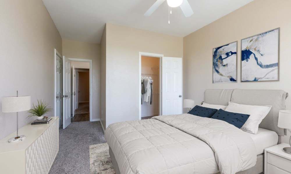 Bedroom , wall-to-wall carpeting in a model home at Villa du Lac Apartment Homes in Slidell, Louisiana