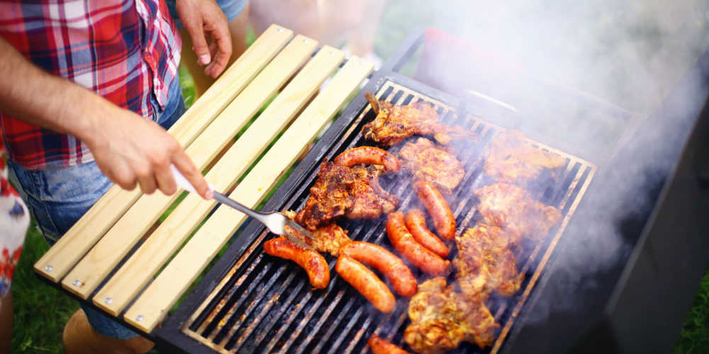 Resident cook meat on grills at The Meridian Apartment Homes in Walnut Creek, California