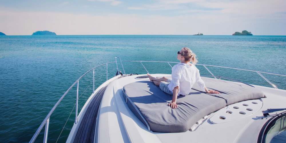 Resident relaxing in a boat at Eugene RV and Boat Storage in Eugene, Oregon