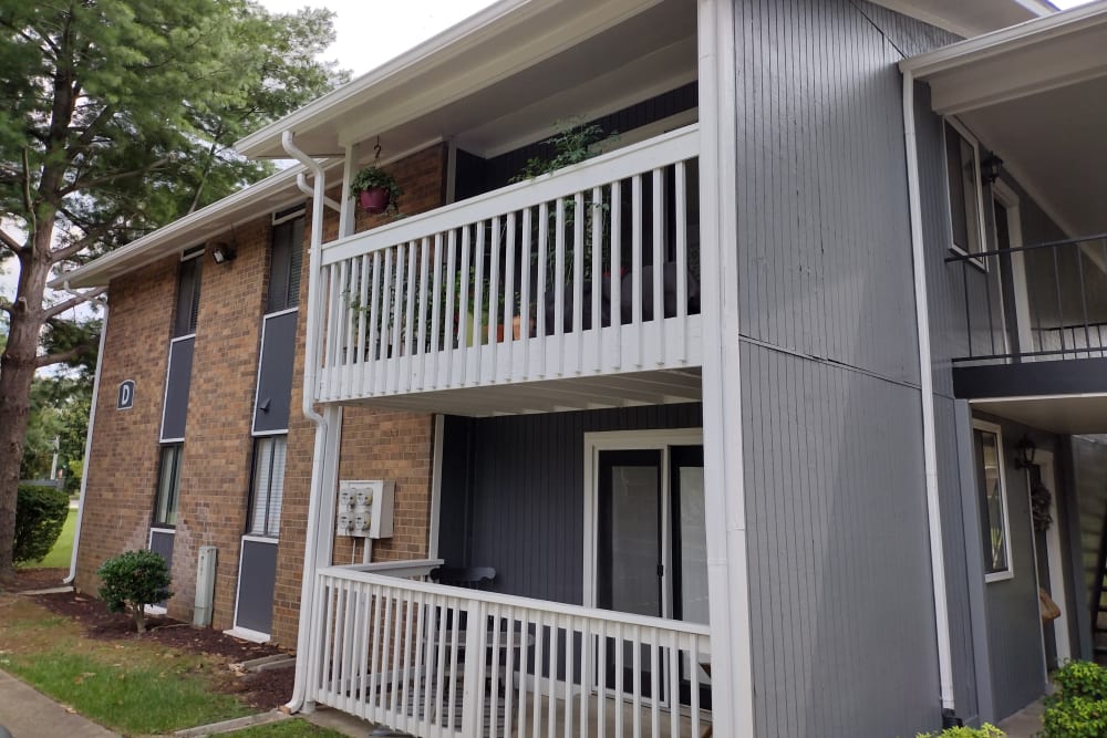 Ground-level covered patio with outdoor furniture at Magnolia Place Apartments in Franklin, Tennessee