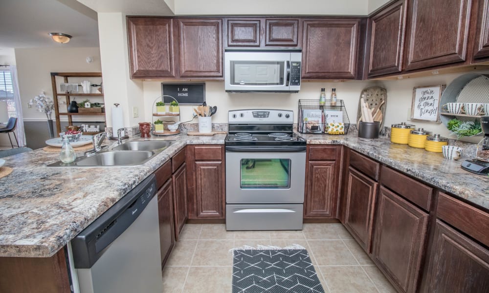 Bright kitchen with stainless appliances at Tuscany Place in Lubbock, Texas.