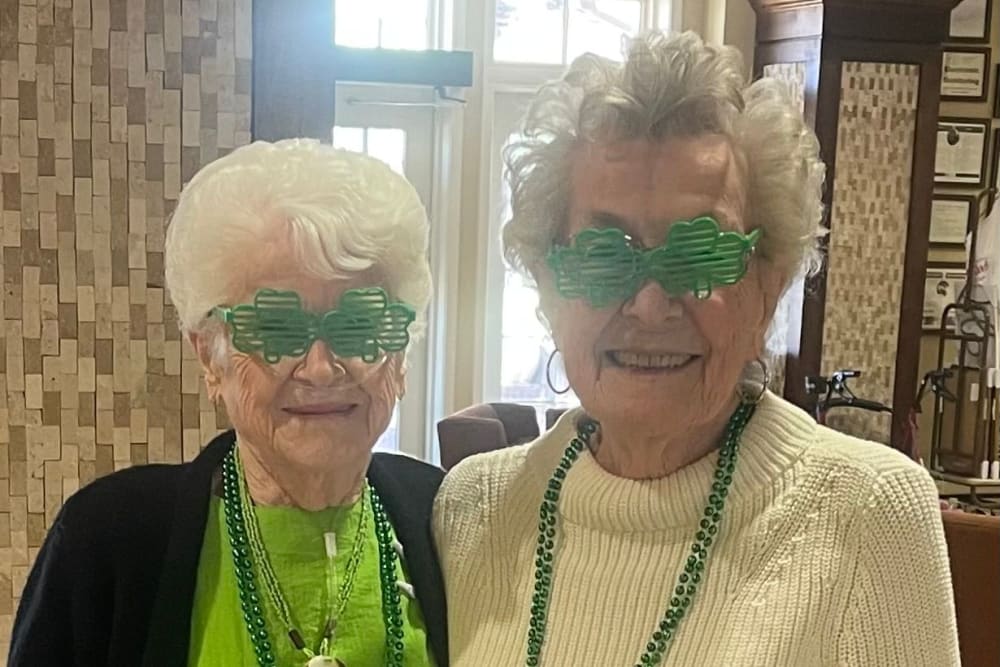 A staff member and two residents enjoying a party at Truewood by Merrill, Keller in Keller, Texas. 