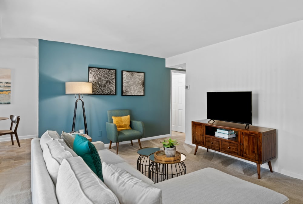 Naturally well lit living room at Gwynn Oaks Landing Apartments & Townhomes, MD
