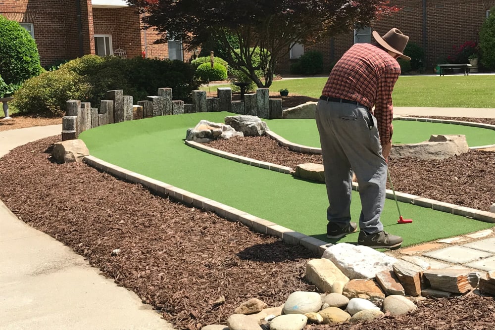 Residents playing minigolf at The Clinton Presbyterian Community in Clinton, South Carolina