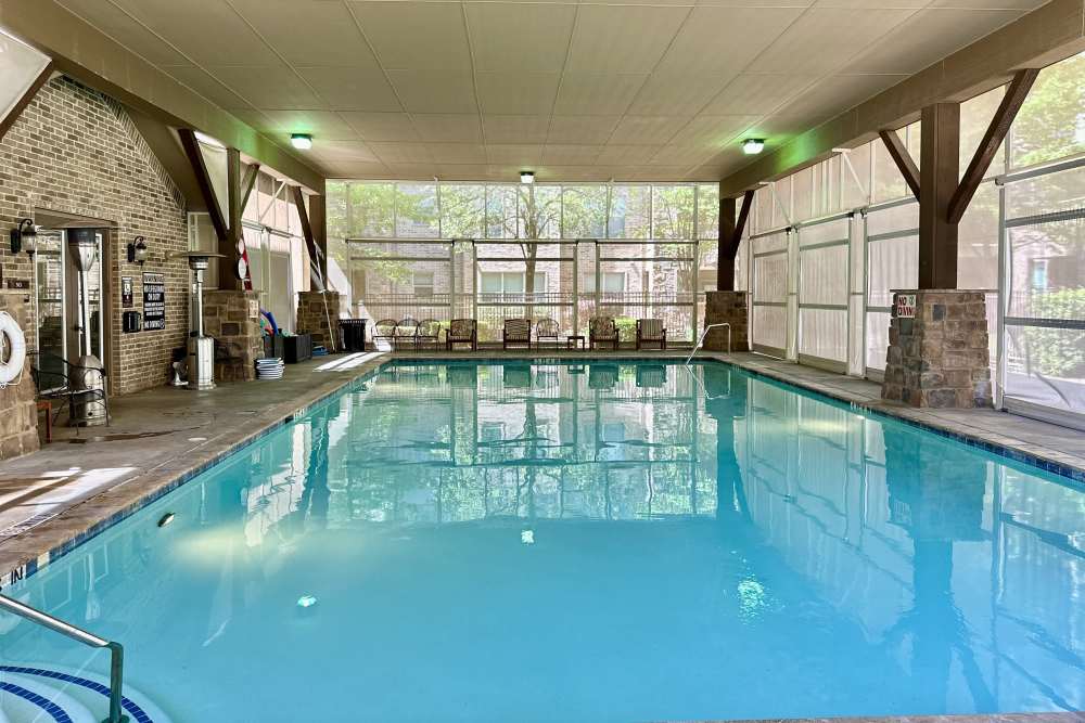 Rectangular lap pool with clear blue water surrounded by comfortable seating