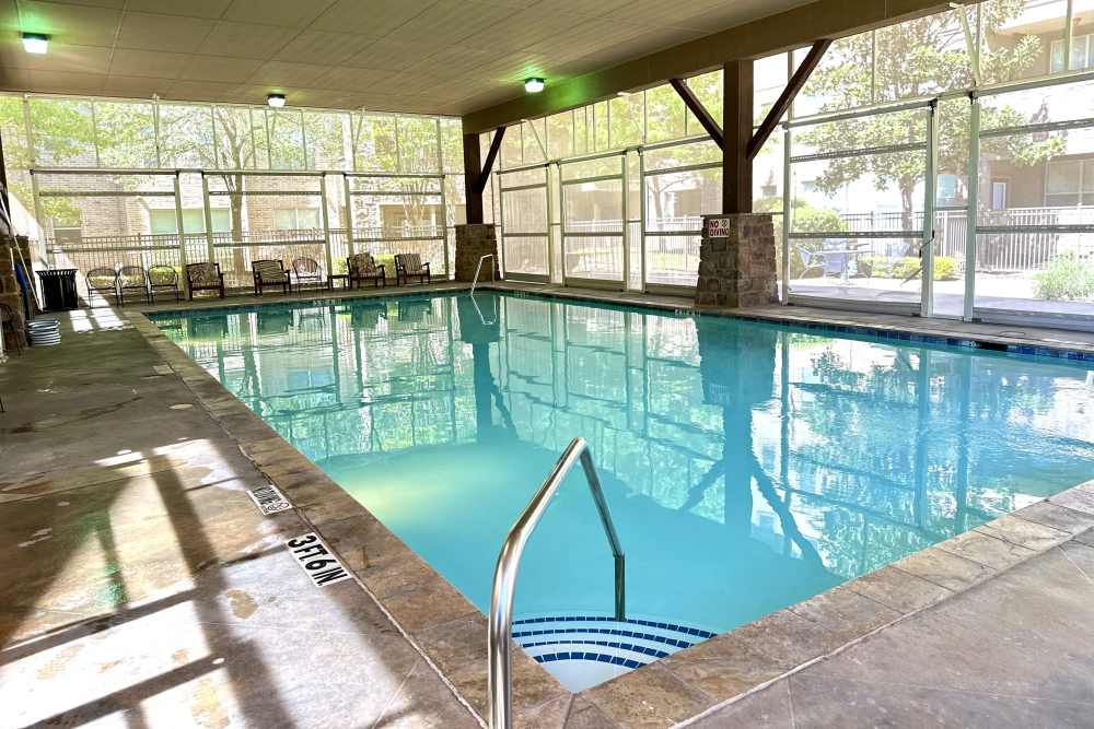 Rectangular lap pool with clear blue water surrounded by comfortable seating