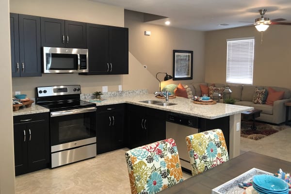 Kitchen leading into the living room at BB Living at Vistancia in Peoria, Arizona