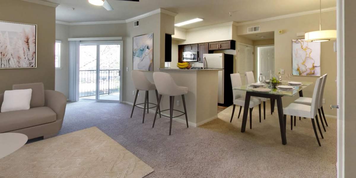 Living room connected to kitchen and patio at Hawthorn Village Apartments in Napa, California