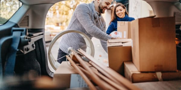 A couple packing items into their car near Key Storage - Sonterra in San Antonio, Texas