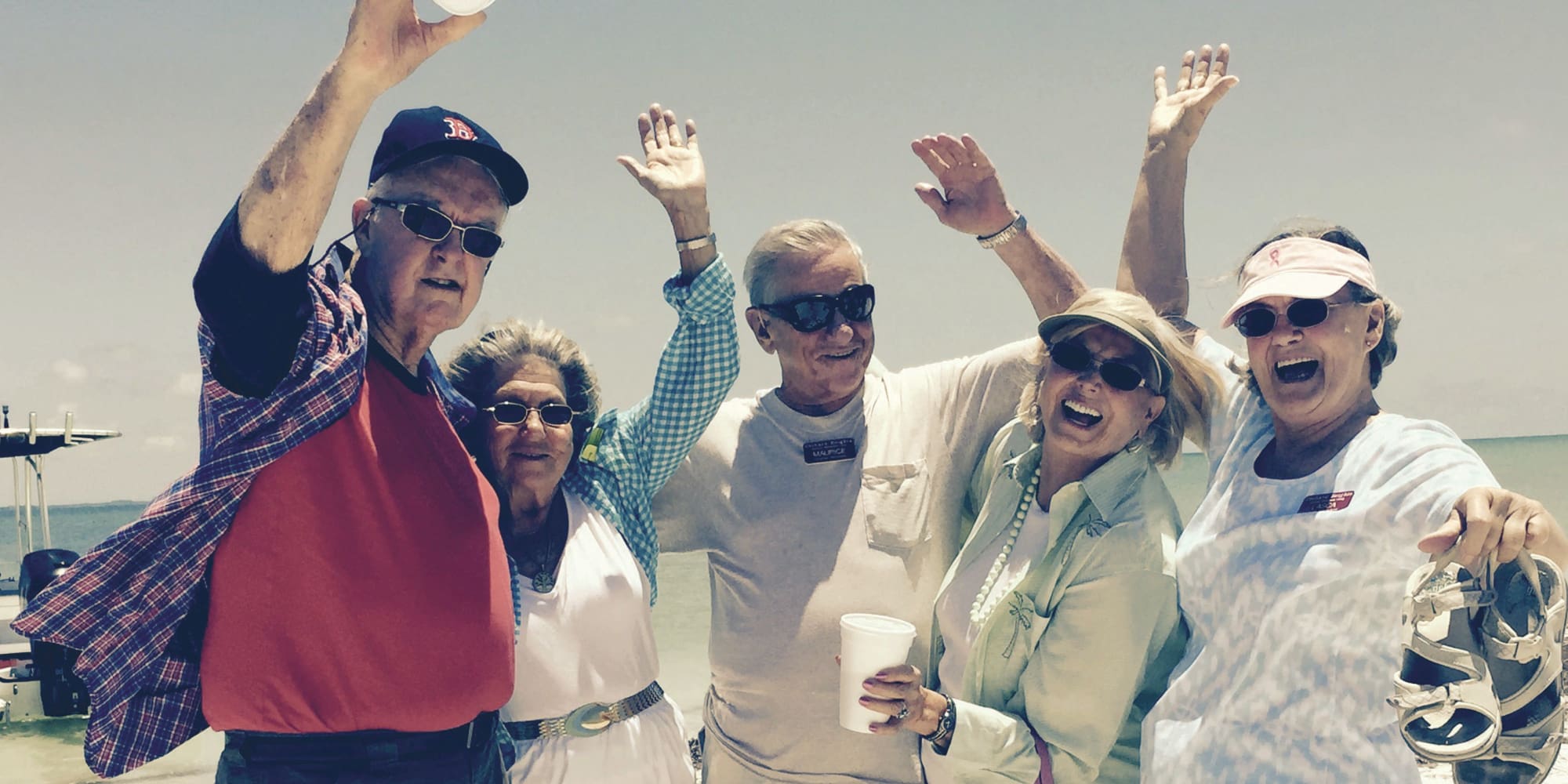 Residents from Magnolia Heights Gracious Retirement Living in Franklin, Massachusetts posing by the water