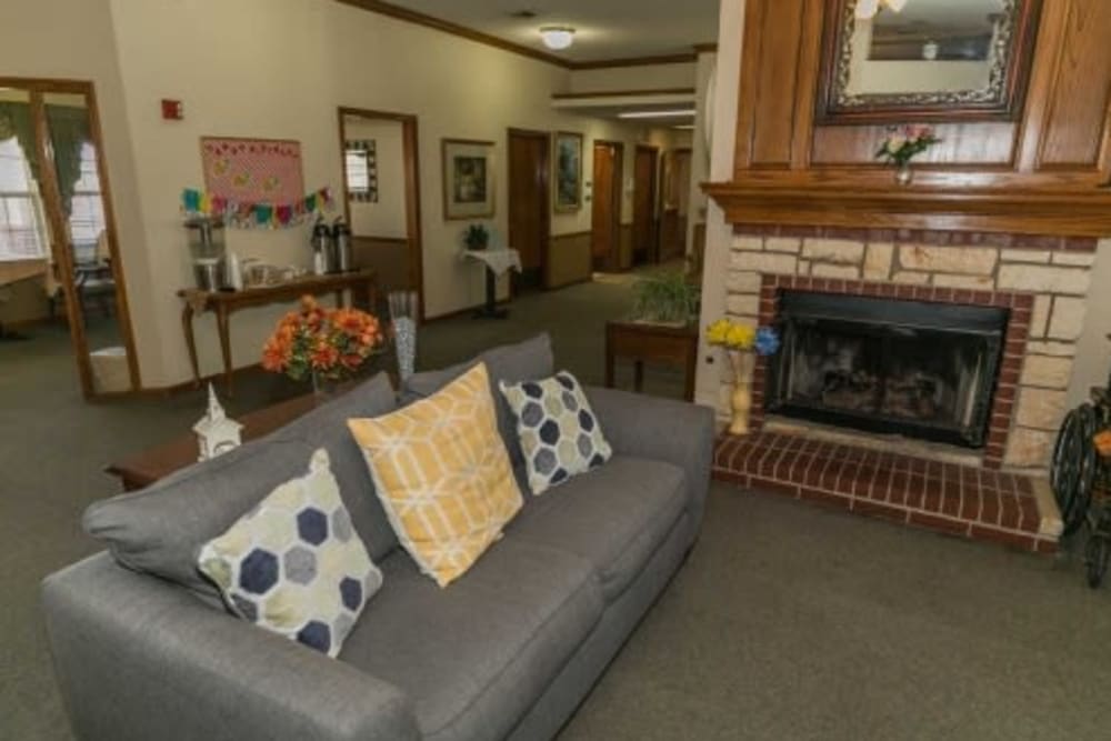 Elegant lounge area with fireplace at Cedar Hill Senior Living in Cedar Hill, Texas