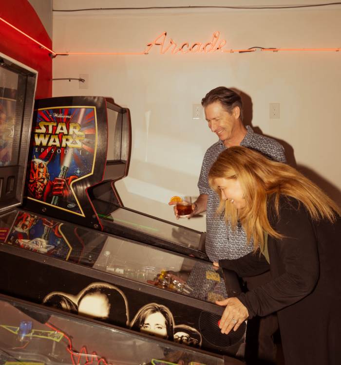 Couple playing arcade games near Midtown Park in Wilmington, Delaware
