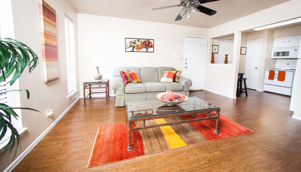 Hardwood floors and ceiling fan in model home's living area at Ashley Oaks in San Antonio, Texas