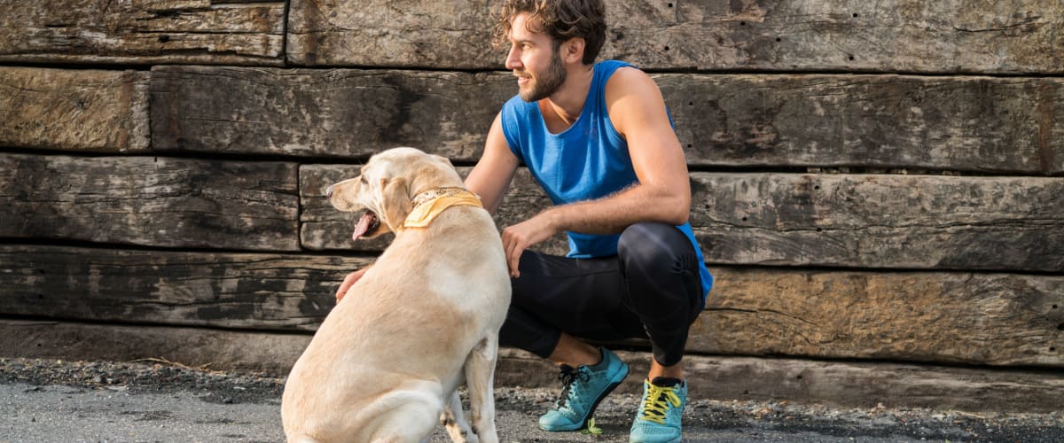 Resident out for a run with his dog at Integra 289 Exchange in DeBary, Florida