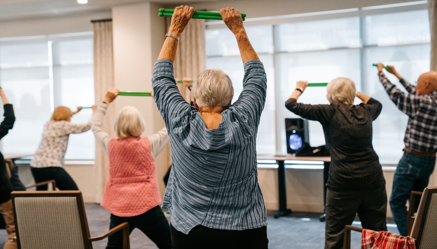 Residents in a workout class at The Pillars of Prospect Park in Minneapolis, Minnesota