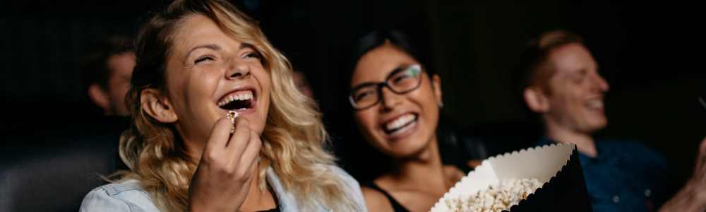 People having a good time in a theatre near Solitair Brickell Apartments in Miami, Florida