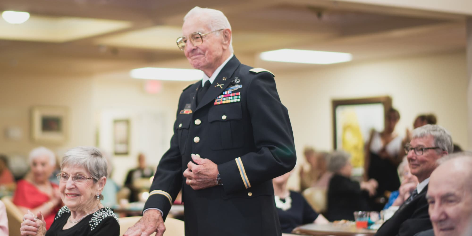 A veteran resident being recognized at Cottonwood Estates Gracious Retirement Living in Alpharetta, Georgia