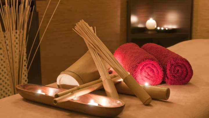 Candles and massage equipment at a spa near The Davis in Fort Worth, Texas