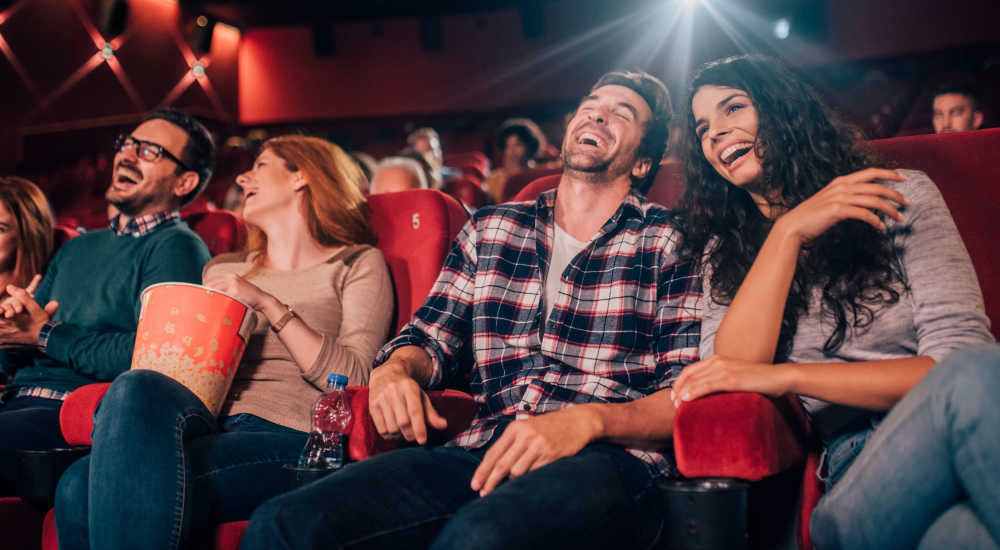 Residents enjoying movie in a theatre near The Crossing in Houston, Texas