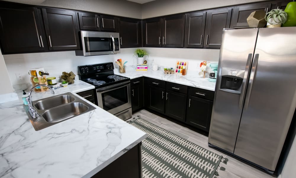 Kitchen with plenty of counter space at Portico at Friars Creek Apartments in Temple, Texas