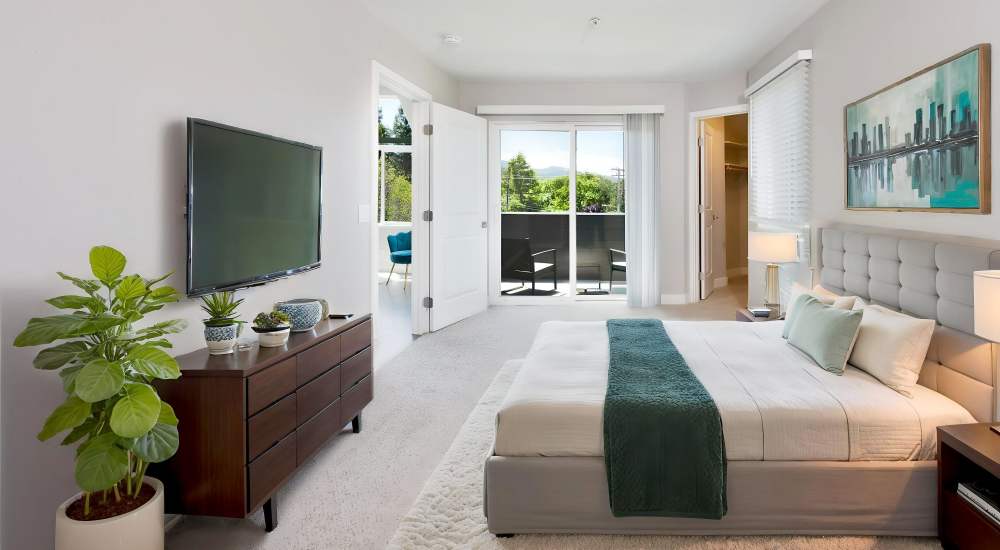 Bedroom with television at Bridgecreek Apartments in Novato, California