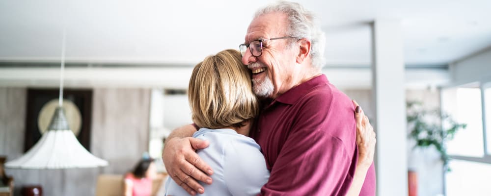 Two people embracing at The Vistas Assisted Living and Memory Care in Redding, California
