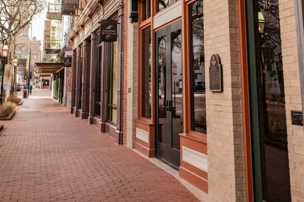 Walking pavement in the neighborhood with shops near Trinity Bluff & Trinity District in Fort Worth, Texas