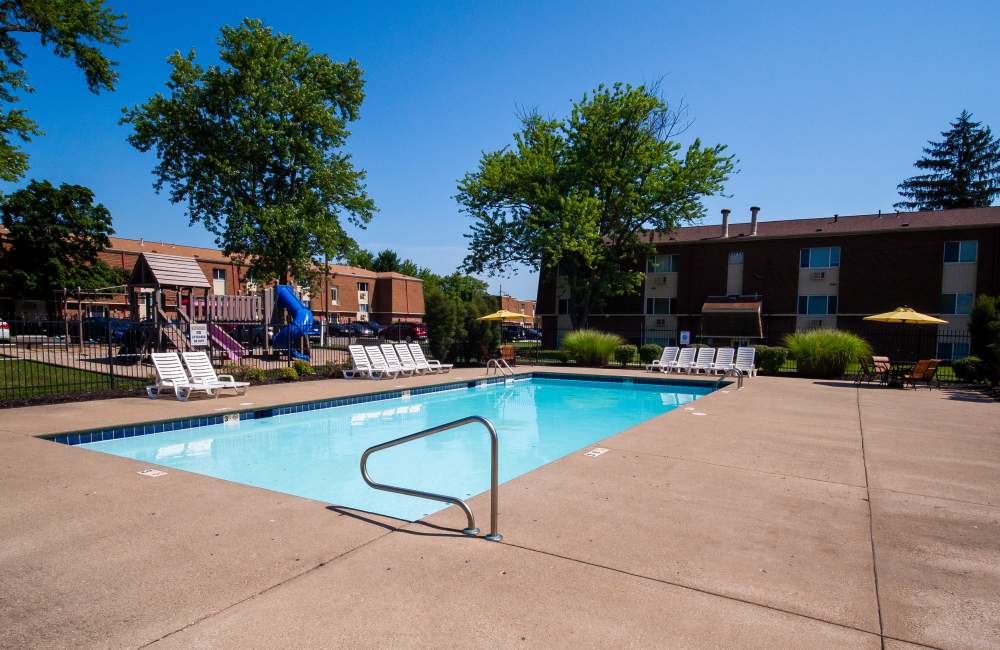 Sparkling pool with lounge chair at Northgate Meadows Apartments in Cincinnati, Ohio