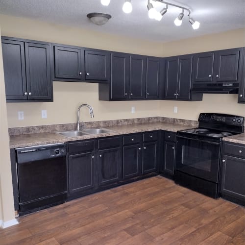 Kitchen with hardwood floors at Madison Pines Apartment Homes in Madison, Alabama