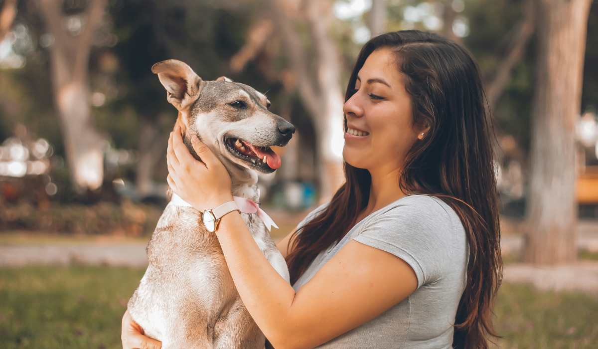 Resident woman with her pet dog at Mosaic at Mueller in Austin, Texas