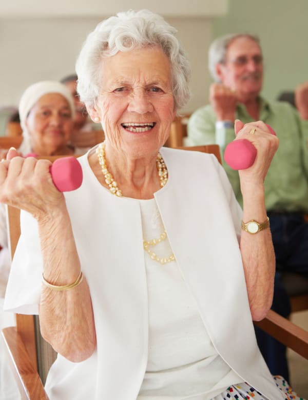 Woman exercising with weights at The Retreat at Jasper in Jasper, Georgia