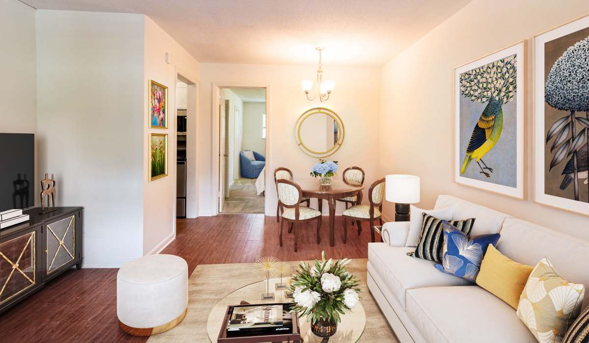 A furnished apartment living room and dining room at The Meadows Apartments in Charlottesville, Virginia