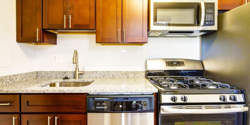 Renovated kitchen with stainless-steel appliances at Tuscany Gardens in Windsor Mill, Maryland