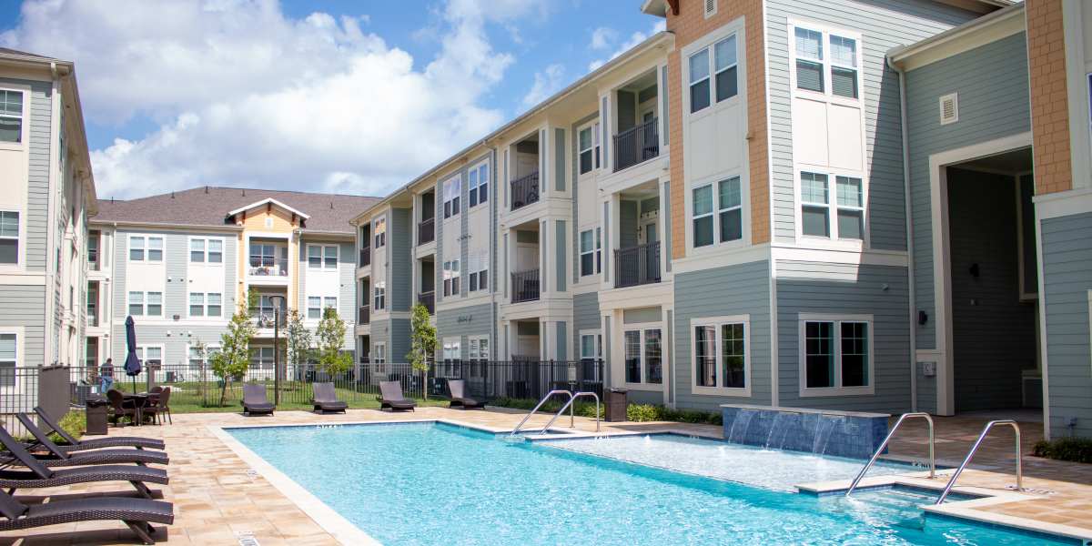 Apartment building exterior showing a swimming pool at Bammel in Houston, Texas