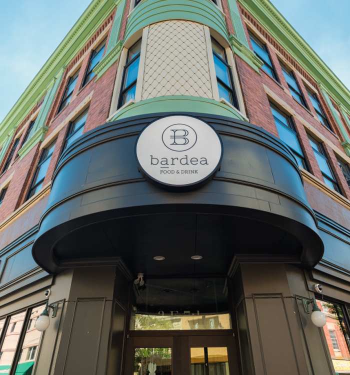 Restaurant entrance with modern signage and architecture near The Residences at Christina Landing in Wilmington, Delaware