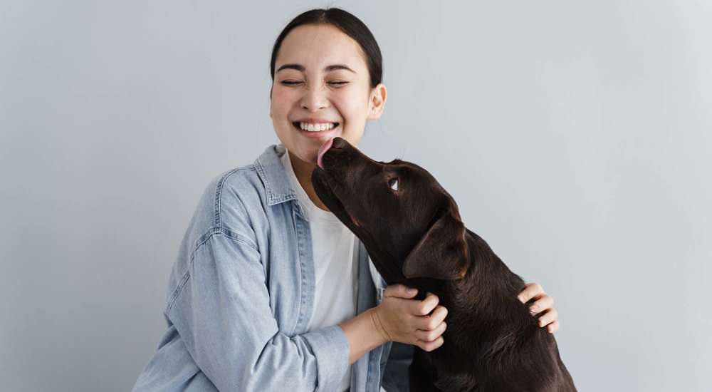 Resident playing with her dog at King's Crest Townhomes in Smyrna, Tennessee