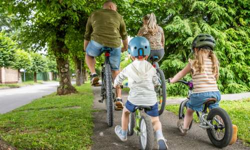 Resident family cycling near Alexander Pointe Apartments in Maineville, Ohio