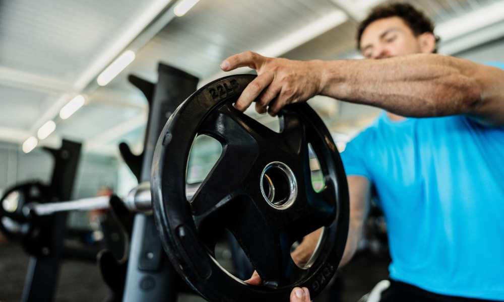 Resident adding weights at Villas of Brownwood in Brownwood, Texas