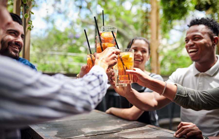 Residents enjoying drinks near The Janson in Del Valle, Texas